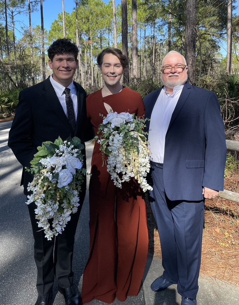 Doug with a couple after their ceremony